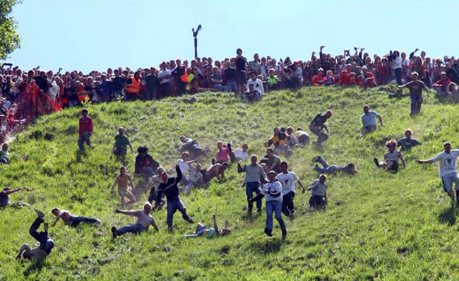 cheese rolling festival 20 Worlds Craziest Festivals